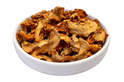 Dried mushrooms in a white bowl on a white background