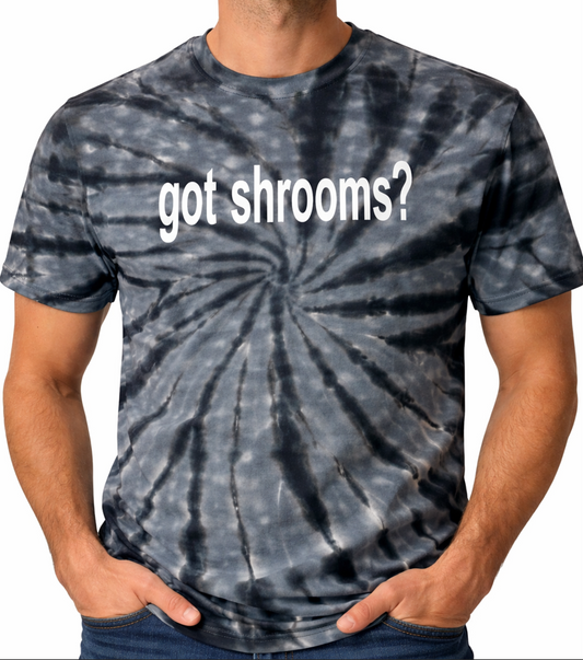 Tie-dye t-shirt with 'got shrooms?' text on a plain background